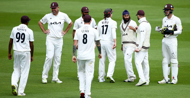 Surrey toil hard in the field on first day
