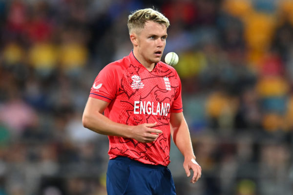 BRISBANE, AUSTRALIA - NOVEMBER 01: Sam Curran of England tosses the ball before bowling during the ICC Men's T20 World Cup match between England and New Zealand at The Gabba on November 01, 2022 in Brisbane, Australia. (Photo by Albert Perez/Getty Images)