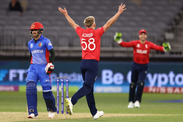 PERTH, AUSTRALIA - OCTOBER 22: Sam Curran of England celebrates after dismissing Fazalhaq Farooqi of Afghanistan and claiming his 5th wicket during the ICC Men's T20 World Cup match between England and Afghanistan at Perth Stadium on October 22, 2022 in Perth, Australia. (Photo by Paul Kane/Getty Images)