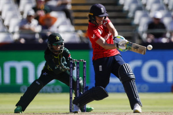England's Nat Sciver-Brunt (R) plays a shot during the Group B T20 women's World Cup cricket match between England and Pakistan at Newlands Stadium in Cape Town on February 21, 2023. (Photo by Marco Longari / AFP) (Photo by MARCO LONGARI/AFP via Getty Images)