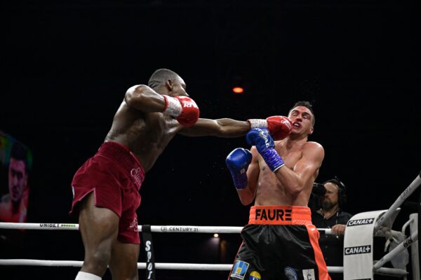 England's Dan Azeez (L) competes with France's Thomas Faure (R) during their International Heavyweight bout, in Paris on March 11, 2023. (Photo by Franck FIFE / AFP) / The erroneous mention[s] appearing in the metadata of this photo by Franck FIFE has been modified in AFP systems in the following manner: [England's Dan Azeez] instead of [France's Tony Yoka], and [France's Thomas Faure] instead of [Cameroonian-born France's Carlos Takam] . Please immediately remove the erroneous mention[s] from all your online services and delete it (them) from your servers. If you have been authorized by AFP to distribute it (them) to third parties, please ensure that the same actions are carried out by them. Failure to promptly comply with these instructions will entail liability on your part for any continued or post notification usage. Therefore we thank you very much for all your attention and prompt action. We are sorry for the inconvenience this notification may cause and remain at your disposal for any further information you may require. (Photo by FRANCK FIFE/AFP via Getty Images)