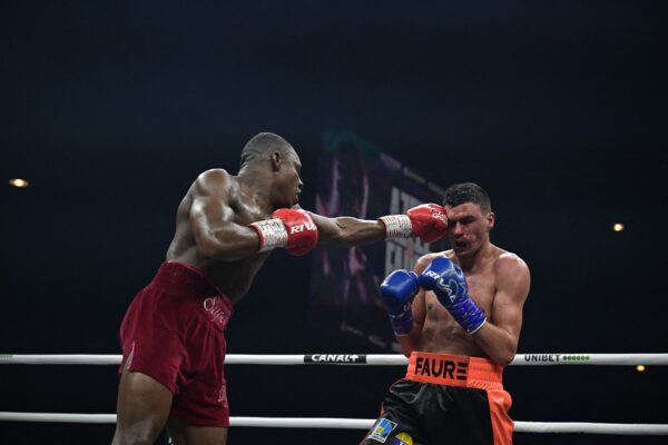 England's Dan Azeez (L) competes with France's Thomas Faure (R) during their International Heavyweight bout, in Paris on March 11, 2023. (Photo by Franck FIFE / AFP) / The erroneous mention[s] appearing in the metadata of this photo by Franck FIFE has been modified in AFP systems in the following manner: [England's Dan Azeez] instead of [France's Tony Yoka], and [France's Thomas Faure] instead of [Cameroonian-born France's Carlos Takam] . Please immediately remove the erroneous mention[s] from all your online services and delete it (them) from your servers. If you have been authorized by AFP to distribute it (them) to third parties, please ensure that the same actions are carried out by them. Failure to promptly comply with these instructions will entail liability on your part for any continued or post notification usage. Therefore we thank you very much for all your attention and prompt action. We are sorry for the inconvenience this notification may cause and remain at your disposal for any further information you may require. (Photo by FRANCK FIFE/AFP via Getty Images)