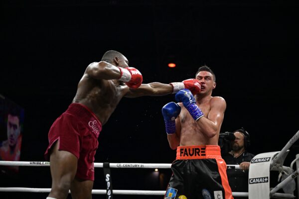 England's Dan Azeez (L) competes with France's Thomas Faure (R) during their International Heavyweight bout, in Paris on March 11, 2023. (Photo by Franck FIFE / AFP) / The erroneous mention[s] appearing in the metadata of this photo by Franck FIFE has been modified in AFP systems in the following manner: [England's Dan Azeez] instead of [France's Tony Yoka], and [France's Thomas Faure] instead of [Cameroonian-born France's Carlos Takam] . Please immediately remove the erroneous mention[s] from all your online services and delete it (them) from your servers. If you have been authorized by AFP to distribute it (them) to third parties, please ensure that the same actions are carried out by them. Failure to promptly comply with these instructions will entail liability on your part for any continued or post notification usage. Therefore we thank you very much for all your attention and prompt action. We are sorry for the inconvenience this notification may cause and remain at your disposal for any further information you may require. (Photo by FRANCK FIFE/AFP via Getty Images)