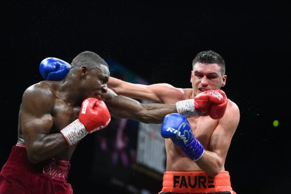 England's Dan Azeez (L) competes with France's Thomas Faure (R) during their International Heavyweight bout, in Paris on March 11, 2023. (Photo by FRANCK FIFE / AFP) / The erroneous mention[s] appearing in the metadata of this photo by Franck FIFE has been modified in AFP systems in the following manner: [England's Dan Azeez] instead of [France's Tony Yoka], and [France's Thomas Faure] instead of [Cameroonian-born France's Carlos Takam] . Please immediately remove the erroneous mention[s] from all your online services and delete it (them) from your servers. If you have been authorized by AFP to distribute it (them) to third parties, please ensure that the same actions are carried out by them. Failure to promptly comply with these instructions will entail liability on your part for any continued or post notification usage. Therefore we thank you very much for all your attention and prompt action. We are sorry for the inconvenience this notification may cause and remain at your disposal for any further information you may require. (Photo by FRANCK FIFE/AFP via Getty Images)