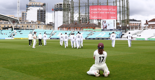 Surrey battle hard on rain affected second day