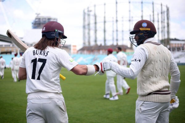 Surrey v Northamptonshire - LV= Insurance County Championship LONDON, ENGLAND - MAY 05: Surrey openers Rory Burns and Ryan Patel pump gloves before walking onto the field of play during the LV= Insurance County Championship match between Surrey and Northamptonshire at The Kia Oval on May 05, 2022 in London, England. (Photo by Charlie Crowhurst/Getty Images for Surrey CCC)