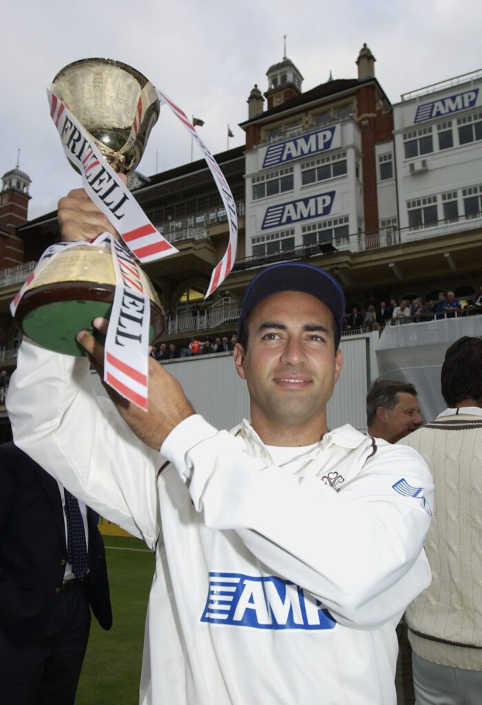 Adam Hollioake celebrates winning title