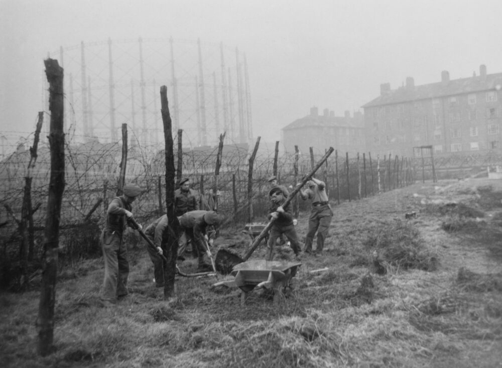 "Troops removing barbed wire fences from Kennington Oval. The ground had been prepared for use as a POW enclosure but was never used as such, although searchlights were stationed there", London, United Kingdom, 21st April 1945. (Central Press/Getty Images)