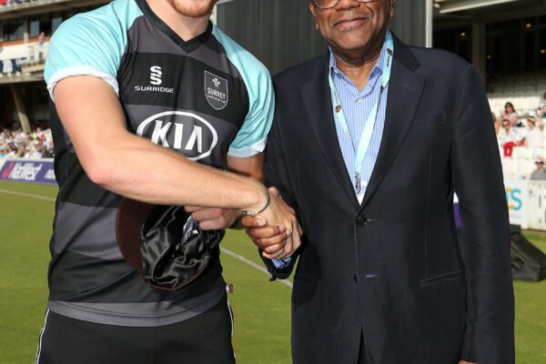 Cricket - NatWest T20 Blast - South Division - Surrey v Essex - Kia Oval Surrey's Matthew Dunn is presented with his 2nd XI cap from Sir Trevor McDonald before the match