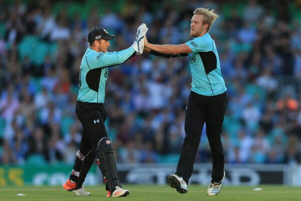 Cricket - NatWest t20 Blast - Southern Division - Surrey v Essex Eagles - Kia Oval Surrey's Matt Dunn (right) celebrates taking the opening wicket of the second innings with wicketkeeper Gary Wilson